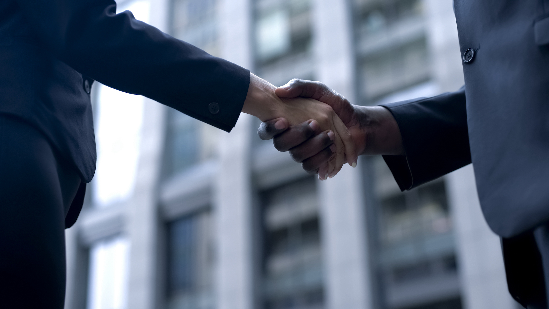 EntrepreneursShakingHandsCooperationAndTrustPartnershipAgreement